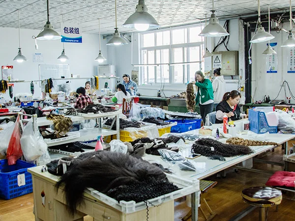 Hair materials at a packing-group work area in a supplier photograph.
