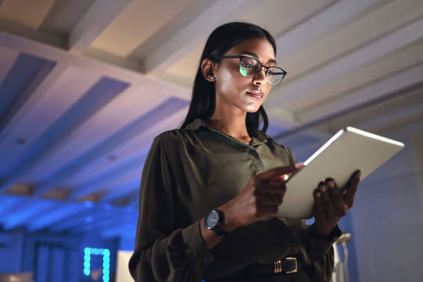 Promotional business image of a professional reviewing information on a tablet