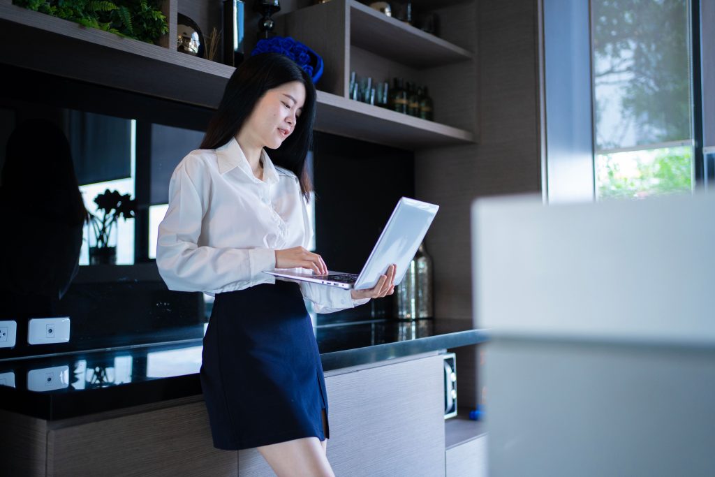Illustrative business image: a professional working on a laptop